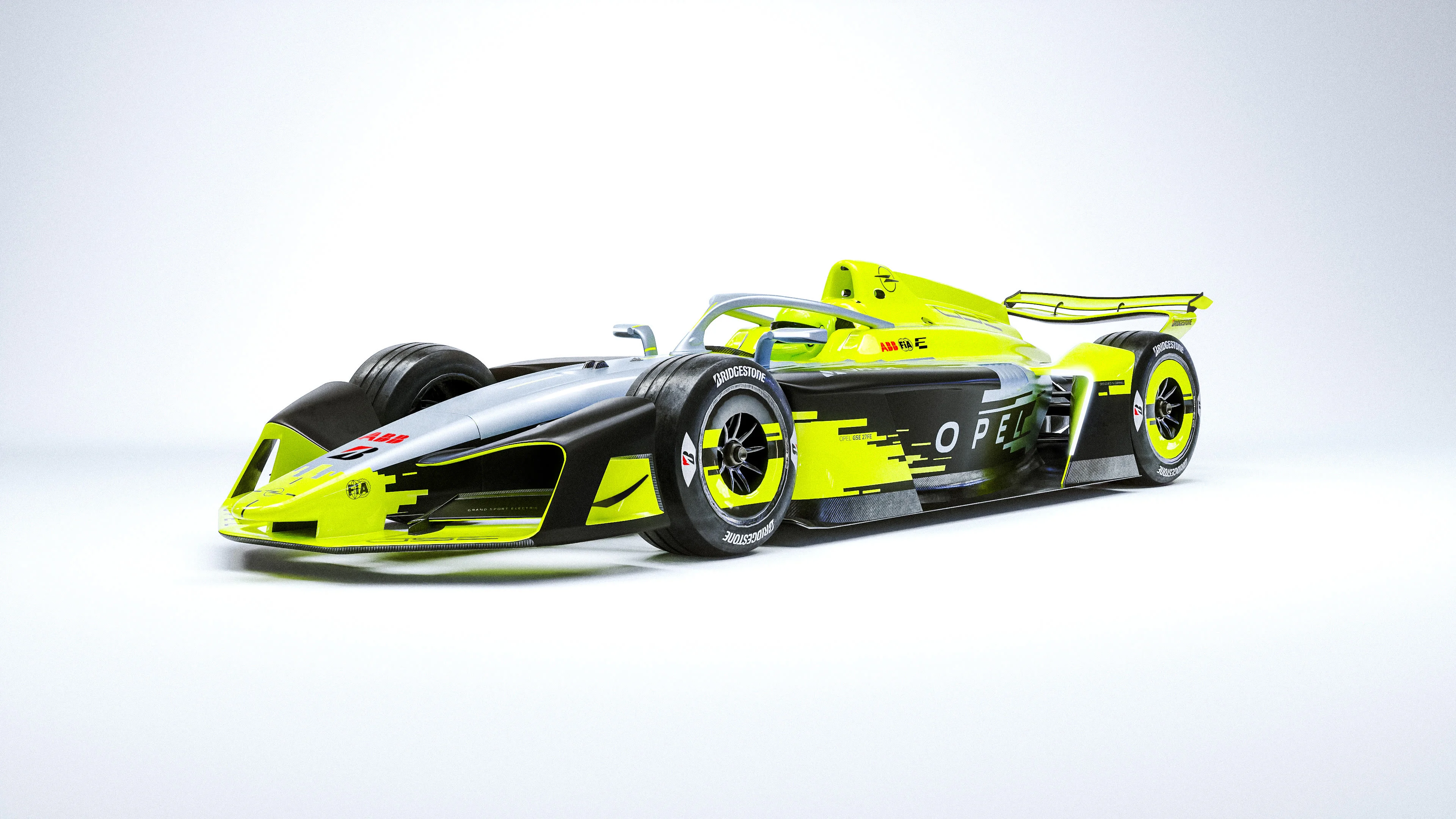 Front three-quarter view of the yellow, silver and black Opel GSE 27FE Formula E car standing on a plain white studio background.